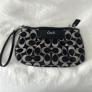 Like new Coach wristlet.  Black and grey-ish pattern. Used only once.